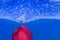 Splash-serie: red apple with blue background