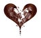 Splashes of chocolate in the shape of a heart with pieces