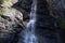 Splashes from falling water of Lillaz waterfall Cascate di Lillaz break on granite ledges of alpine rocks