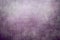 Splattered purple paint on a canvas