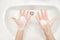 Splayed children`s hands with soapy foam