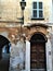 Splendid ancient door and wall in Saluzzo town, Piedmont region, Italy. History, enchanting architecture and art