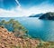 Splendid Mediterranean seascape in Turkey. Sunny view of a small azure bay near the Tekirova village vith Mt. Tahtali on