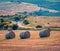 Splendid morning scene of the wheat harvest in Tuscany. Sunny summer view of Italian countryside. Beauty of countryside concept