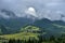 Splendid mountain valley is covered with fog after the rain with green alpine meadows. Foggy landscape. Location place Carpathian