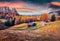 Splendid outdoor scene of Alpe di Siusi mountain plateau with beautiful orange larch trees. Gorgeous autumn view of Dolomite Alps,