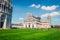 Splendid spring view of famous Leaning Tower in Pisa. Sunny morning scene with hundreds of tourists in Piazza dei Miracoli Square