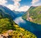 Splendid summer scene of Sunnylvsfjorden fjord, Geiranger village location, western Norway. Aerial view of famous Seven Sisters