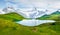 Splendid summer view of the Bachalpsee lake with Schreckhorn peak on background. Colorful morning scene of Swiss Bernese Alps,