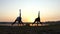 Splendid Sunset And Women Doing Yoga Exercise on a Lake Bank in Slo-Mo