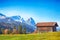 Splendid view of alpine meadow near Wagenbruchsee (Geroldsee) lake with wooden huts