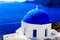 Splendid view of the deep blue Aegean with Cycladic church in Santorini (Oia), Greece