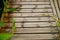 Spliced wooden planks are laid on the ground as architectural decorations in tourist attractions