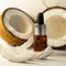 Split coconuts with coconut essential oil. Coconut serum for the face. A bottle of whey oil with a pipette on a white-beige