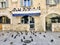 Split, Croatia - July 7th, 2019: An empty courtyard in Spit, Croatia, surrounded with pigeons.