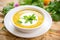 split pea soup garnished with yogurt and mint leaves