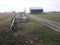 Split rail fence alongside road to barn