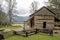 A split rail fence leads to the Elijah Oliver House in Cades Cove.