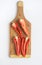 Split Red Peppers on Wooden Cutting Board