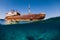 Split shot with wreckship in blue ocean. Arrecife, Lanzarote
