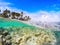 Split underwater view of La Caravelle shore in Guadeloupe