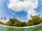 split underwater view of tropical  beach