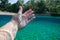 Split view of man hand underwater