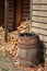 Split wood pile beside hardwood kindling barrel