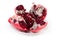 Splitted pomegranate fruit on the white dish close-up