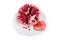 Splitted pomegranate fruit on the white dish on white backgroun