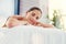 Spoil yourself today. a beautiful young woman lying on a massage table at the day spa.