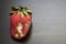 Spoiled strawberries covered in mold on the table