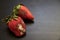 Spoiled strawberries covered in mold on the table