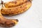 Spoiled tainted bananas on grey background. Ugly food trendy photo. Food waste, food garbage