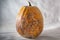 Spoiled vegetable. Dry and rotten and dried pumpkin on a white background. Dangerous food