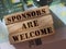 SPONSORS are WELCOME Know Your Worth on wooden blocks pur on 100 Euro banknotes. Sponsorship donation support business