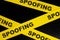 Spoofing cybercrime alert, caution and warning concept. Yellow barricade tape with word spoofing