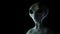 Spooky alien on black background. 3D rendered illustration.