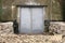 Spooky and Creepy Gray Steel Double Door Leading into Damp Concrete Building