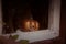 Spooky Glittering pumpkin looking out old window. Halloween house decoration