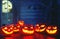 Spooky halloween background. scary pumpkin with burning eyes and