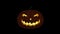 Spooky Halloween Pumpkin Animation with flickering light inside - Jack-o`-lantern. Loop / looping is possible. On Black Background