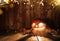 Spooky halloween pumpkin on wooden planks in dark cellar.