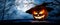 The spooky haunted evil glowing eyes of Jack O\' Lanterns, halloween pumpkin, on a wooden bench