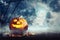 Spooky Jack O Lantern pumpkin surrounded by mystical mist under moon on Halloween. Space for text