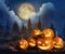 Spooky Jack O Lantern pumpkins with creepy spider in misty forest under moon on Halloween