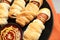 Spooky sausage mummies and sauce for Halloween party on plate