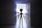 Spooky silhouettes of aliens standing in door. Bright light in background. 3D rendered illustration.