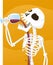 Spooky skeleton drinking wine