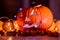 Spooky smiling halloween pumpkin in burning fire candles flames.